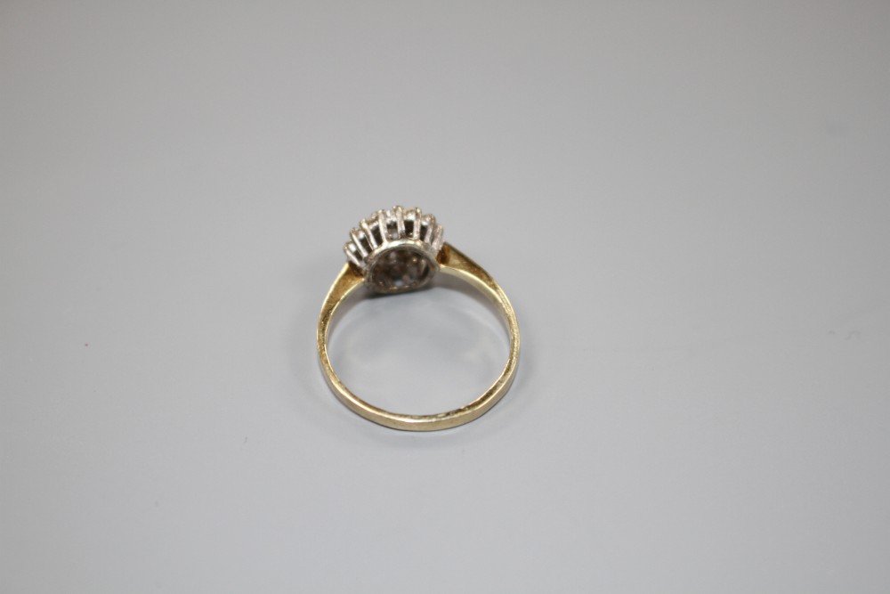 A modern 9ct gold and diamond cluster ring, size O, gross weight 2.2 grams.